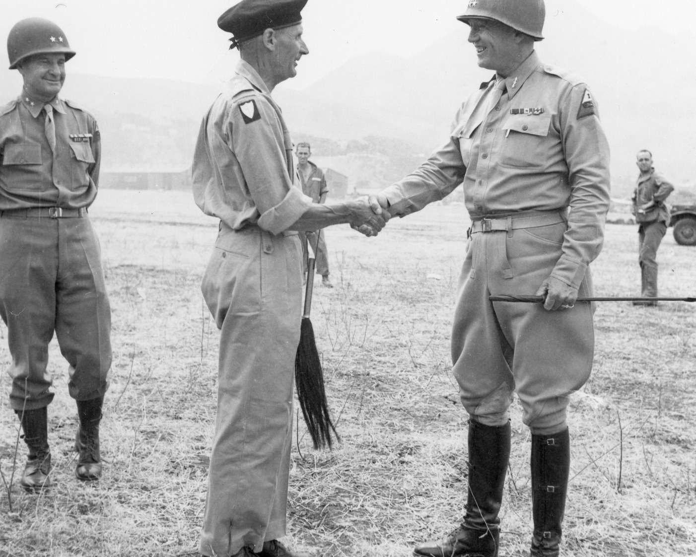 Black-and-white archive photograph of Generals George Patton and Bernard Montgomery